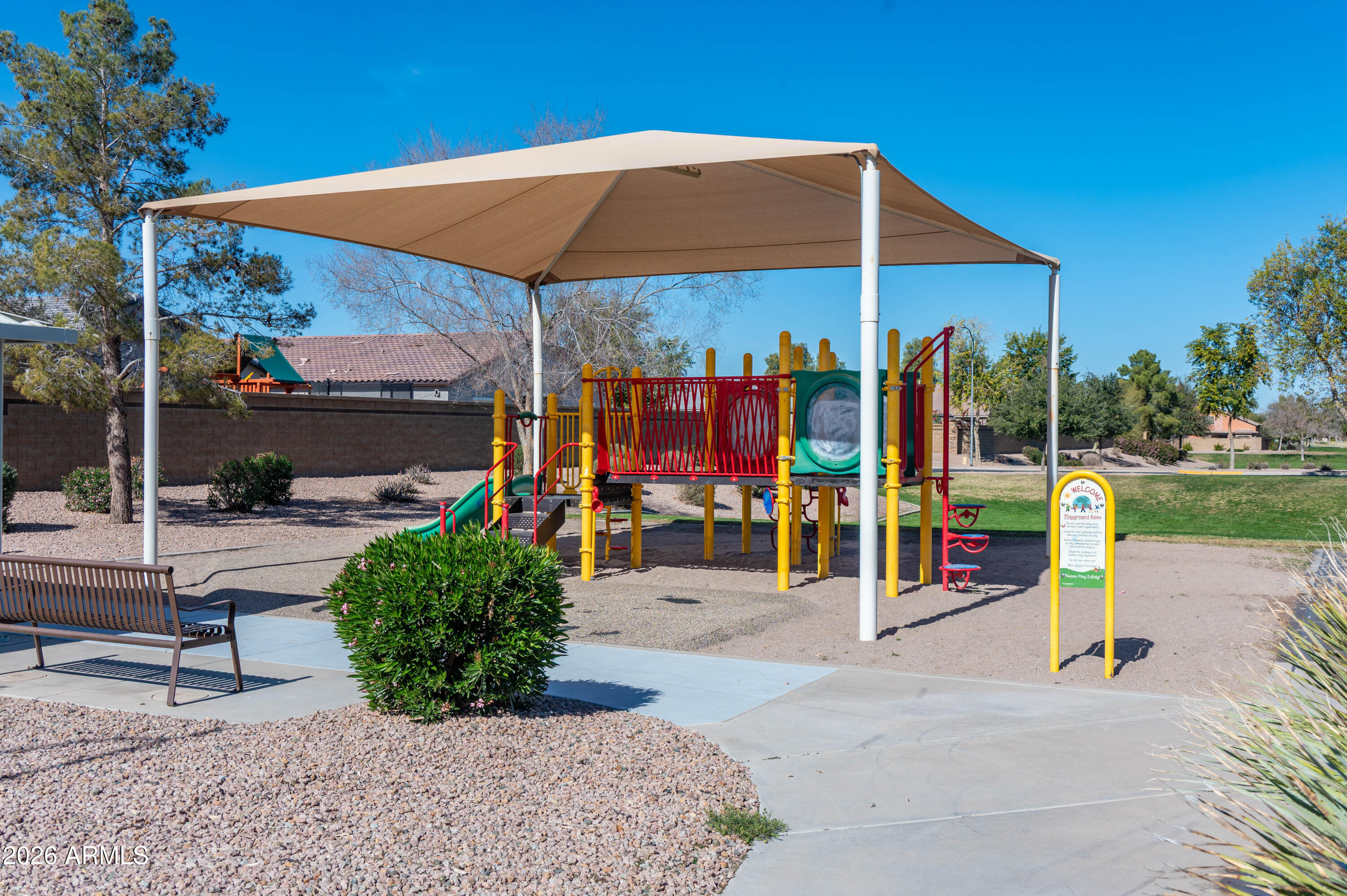 45633 West Mountain View Road Maricopa, AZ 85139 - Photo 68 of 78 a view of a park with plants and a patio