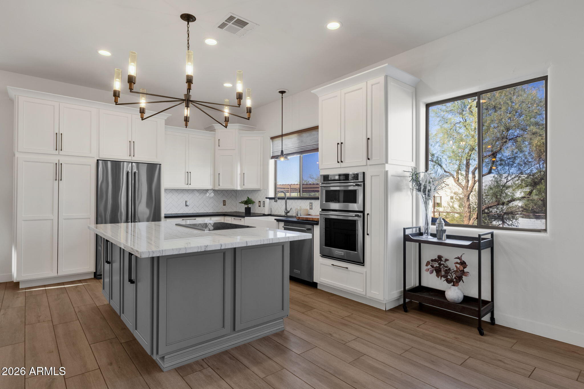 14604 East Peak View Road Scottsdale, AZ 85262 - Photo 9 of 55 a kitchen with kitchen island stainless steel appliances a stove a sink a refrigerator and cabinets