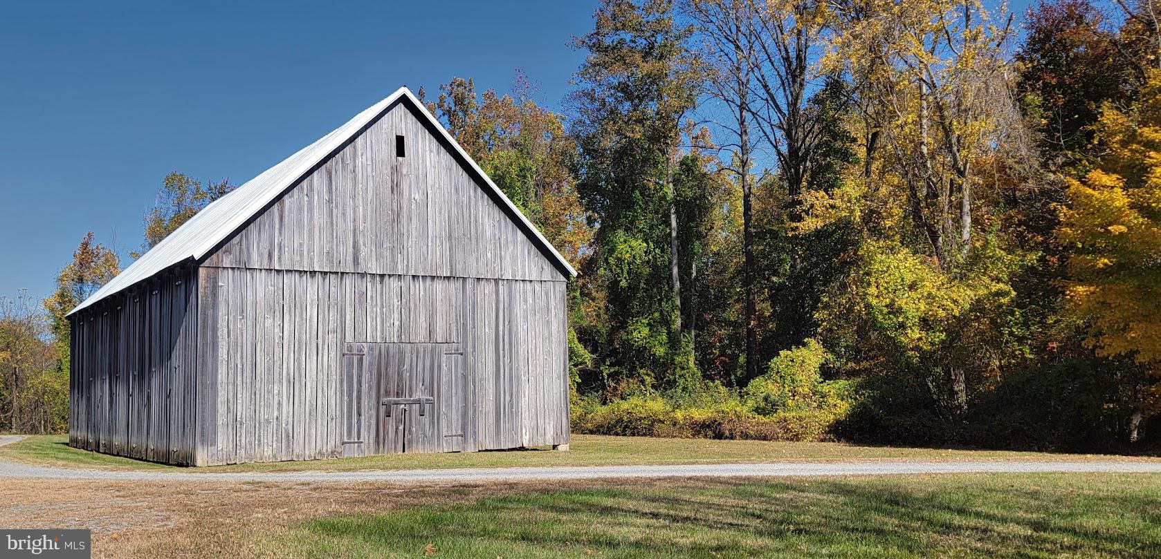 Magruders Ferry Road, Unit PARCEL C Brandywine, MD 20613 - Photo 30 of 39 a view of house with backyard and trees