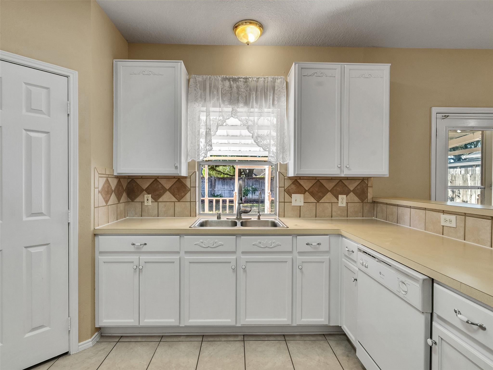 4815 Cottage Stone Lane Katy, TX 77449 - Photo 19 of 48 a kitchen with white cabinets and sink