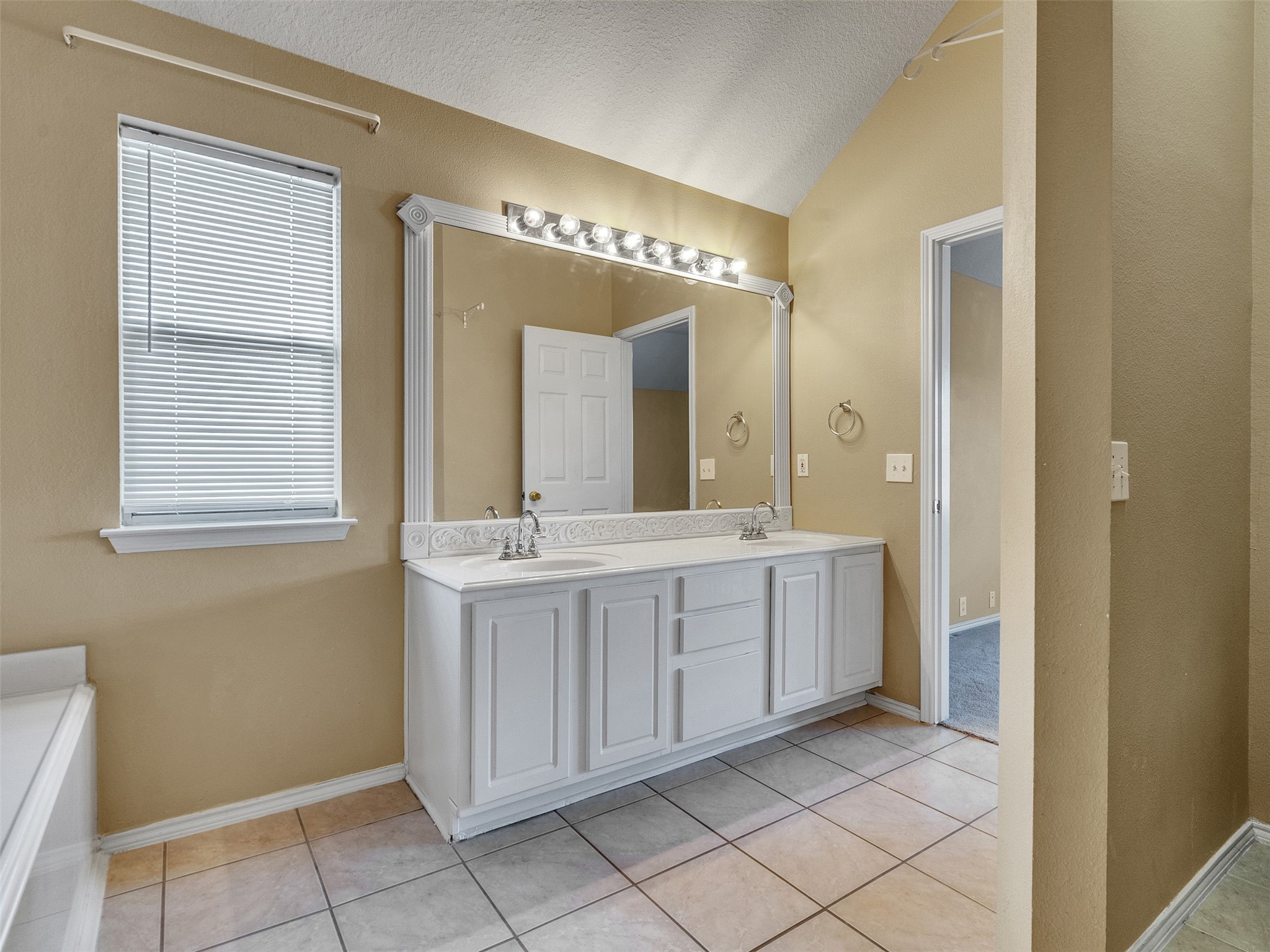 4815 Cottage Stone Lane Katy, TX 77449 - Photo 33 of 48 a spacious bathroom with a mirror sink and vanity