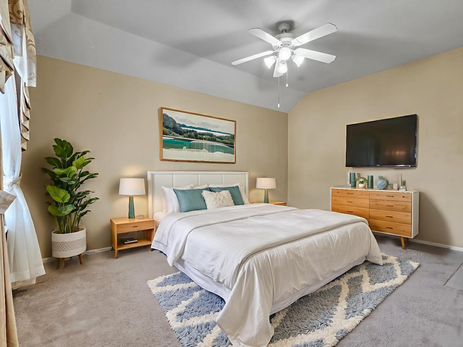 4815 Cottage Stone Lane Katy, TX 77449 - Photo 37 of 48 a bedroom with a bed and a flat screen tv