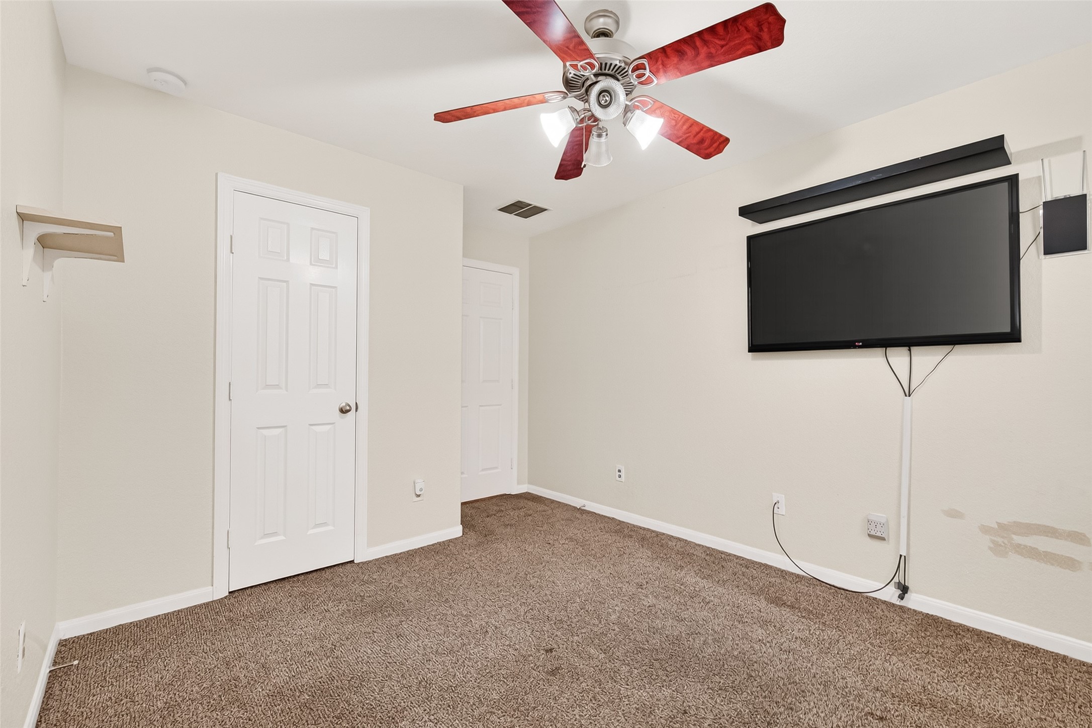 16715 Mackenzie Mesa Drive Spring, TX 77379 - Photo 33 of 50 a view of a livingroom with a flat screen tv