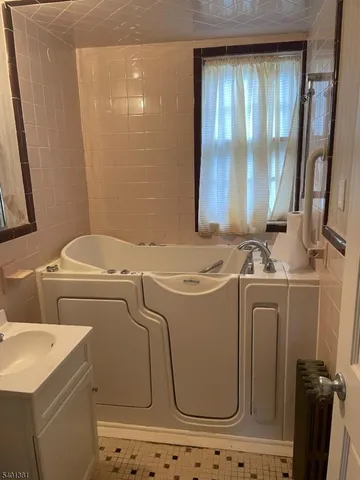a kitchen with a sink cabinets and window