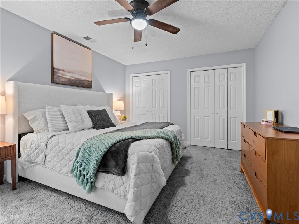 6712 Hedges Road Richmond, VA 23224 - Photo 19 of 34 Carpeted bedroom featuring a ceiling fan, two bifo