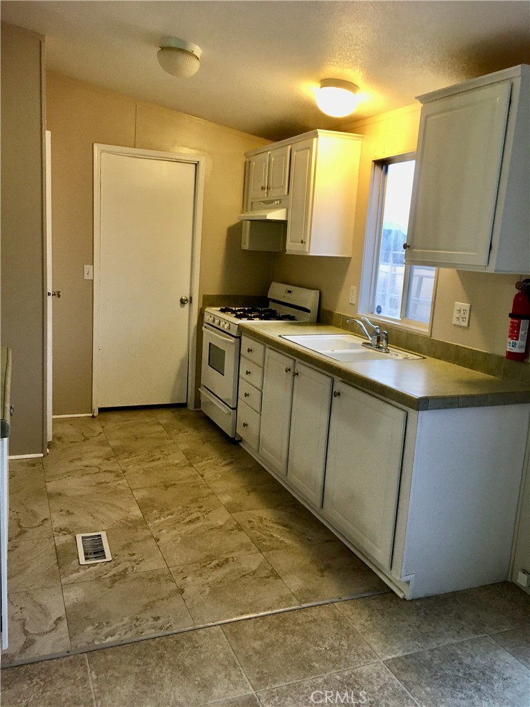 14121 Lakota Road Apple Valley, CA 92307 - Photo 33 of 40 Back house kitchen