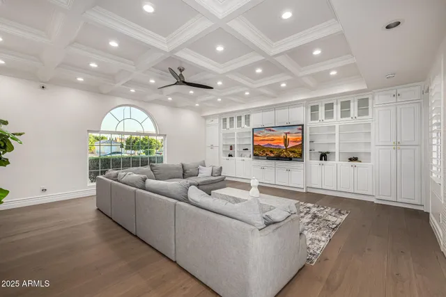 a large kitchen with kitchen island a sink a stove a center island and a cabinets