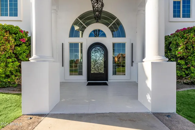 a bathroom with a sink a mirror a vanity and shower