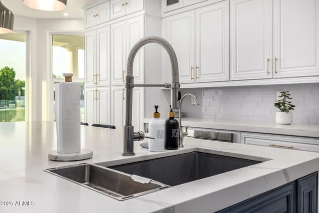 a view of a workspace with furniture and a potted plant