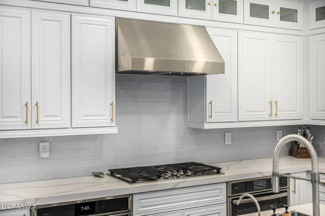 a view of a hallway view with living room and wooden floor