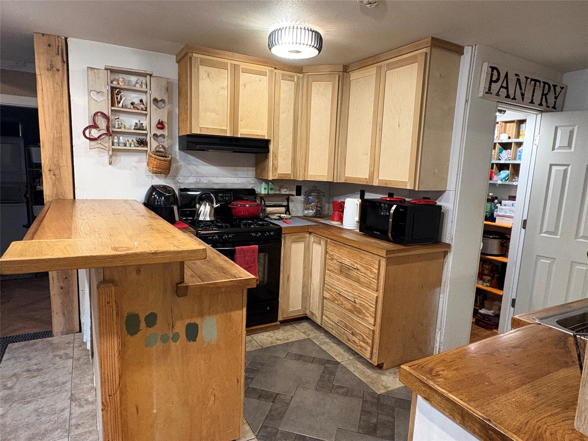 550 Dogwood Road Cleveland, TX 77328 - Photo 35 of 49 a kitchen with cabinets appliances and a window