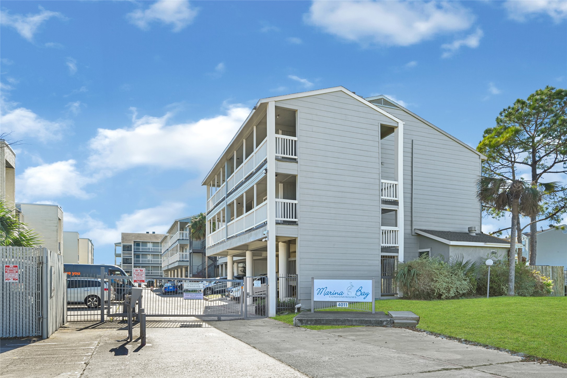 4011 NASA Road 1, Unit 406 El Lago, TX 77586 - Photo 1 of 23 a front view of a building with garden