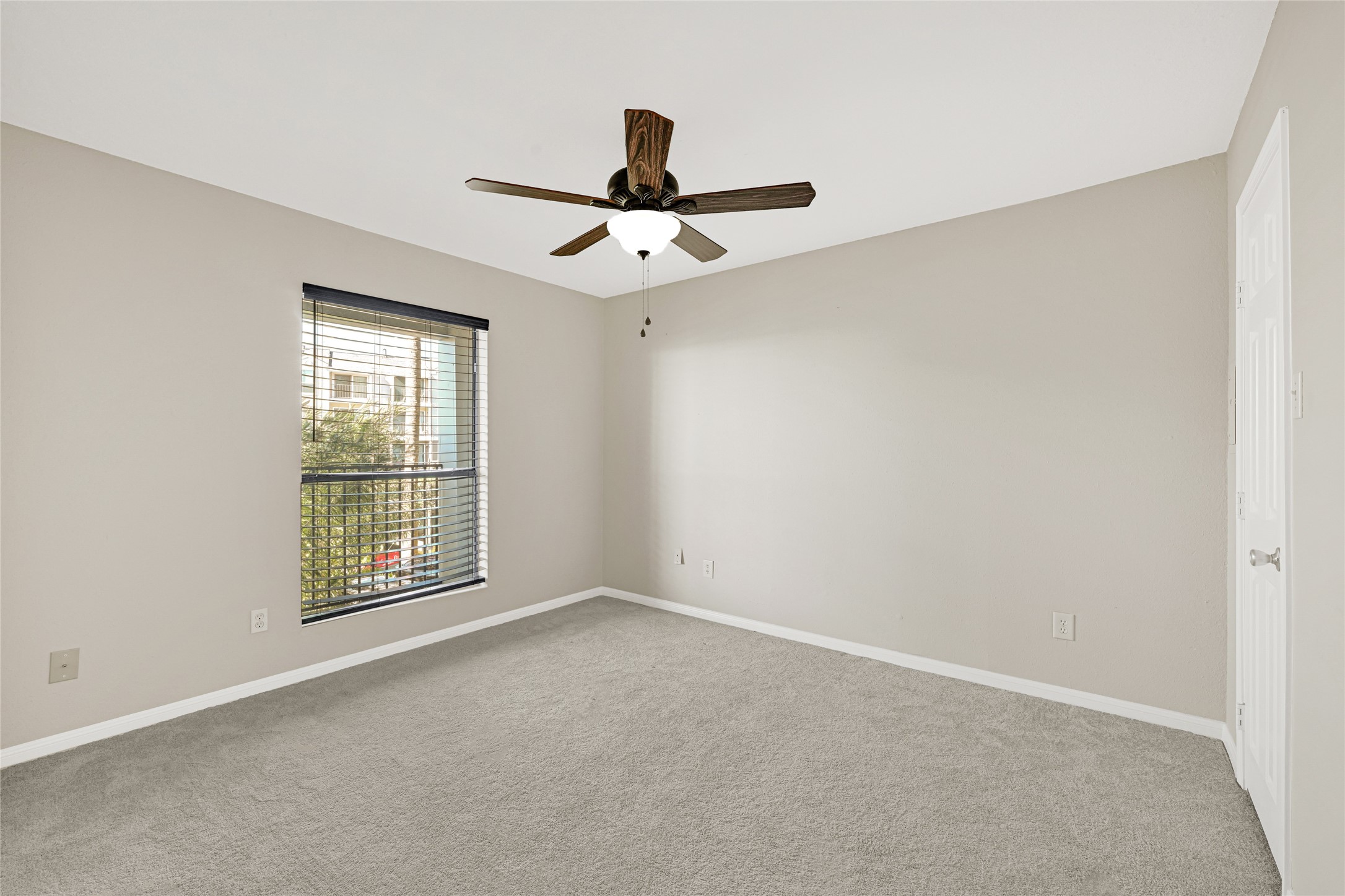 4011 NASA Road 1, Unit 406 El Lago, TX 77586 - Photo 14 of 23 an empty room with windows and fan