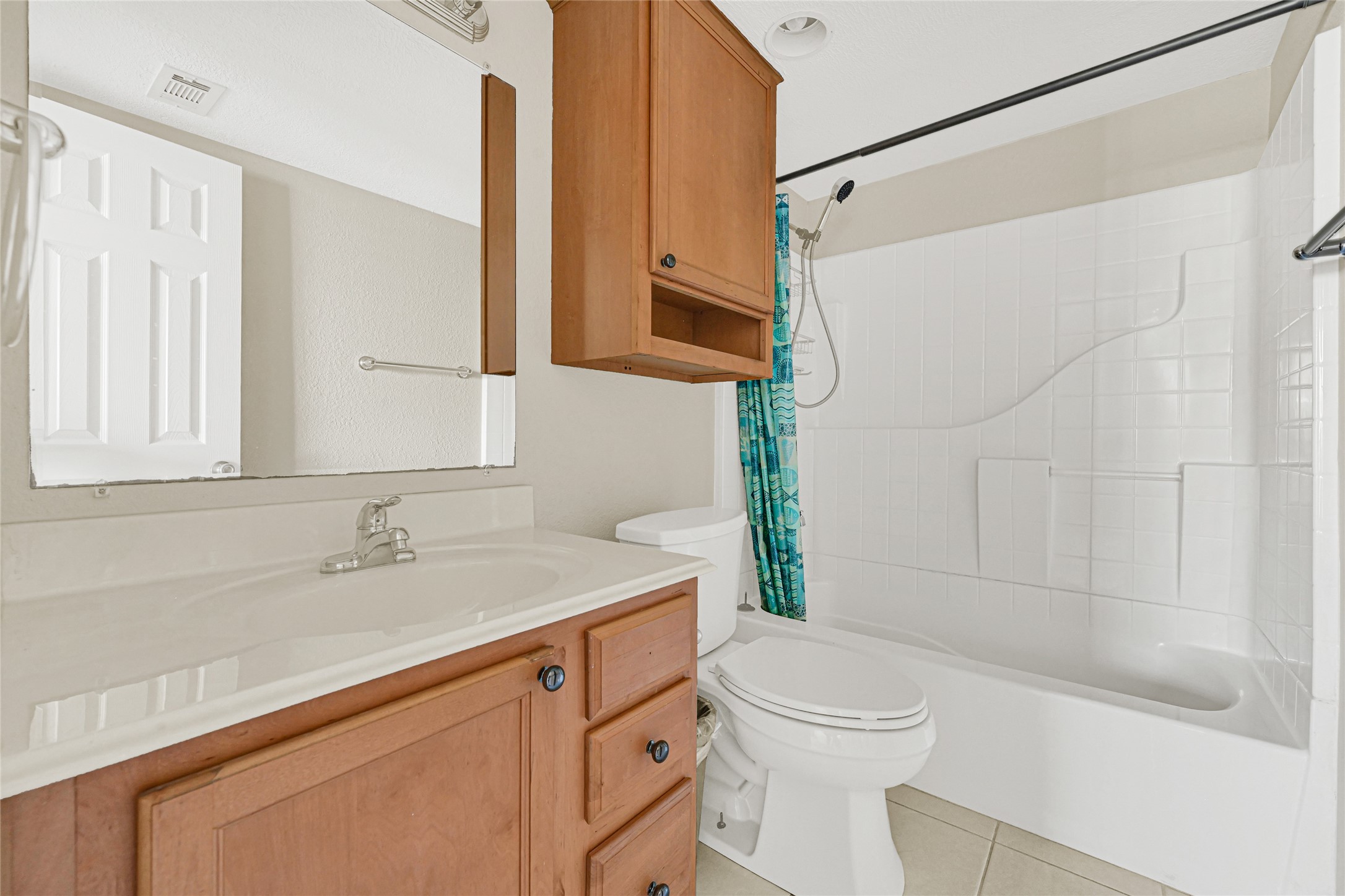4011 NASA Road 1, Unit 406 El Lago, TX 77586 - Photo 15 of 23 a bathroom with a sink a toilet and shower