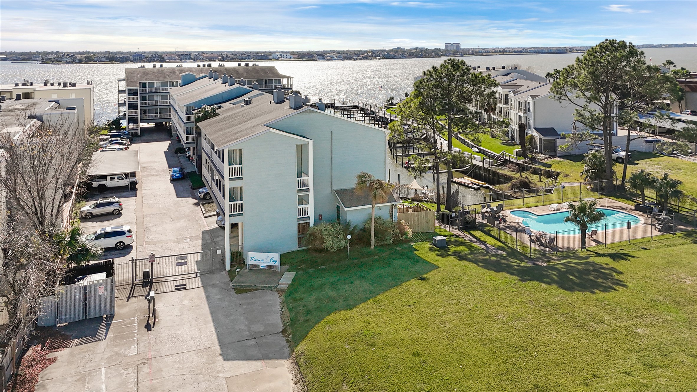 4011 NASA Road 1, Unit 406 El Lago, TX 77586 - Photo 19 of 23 a view of a house with a backyard