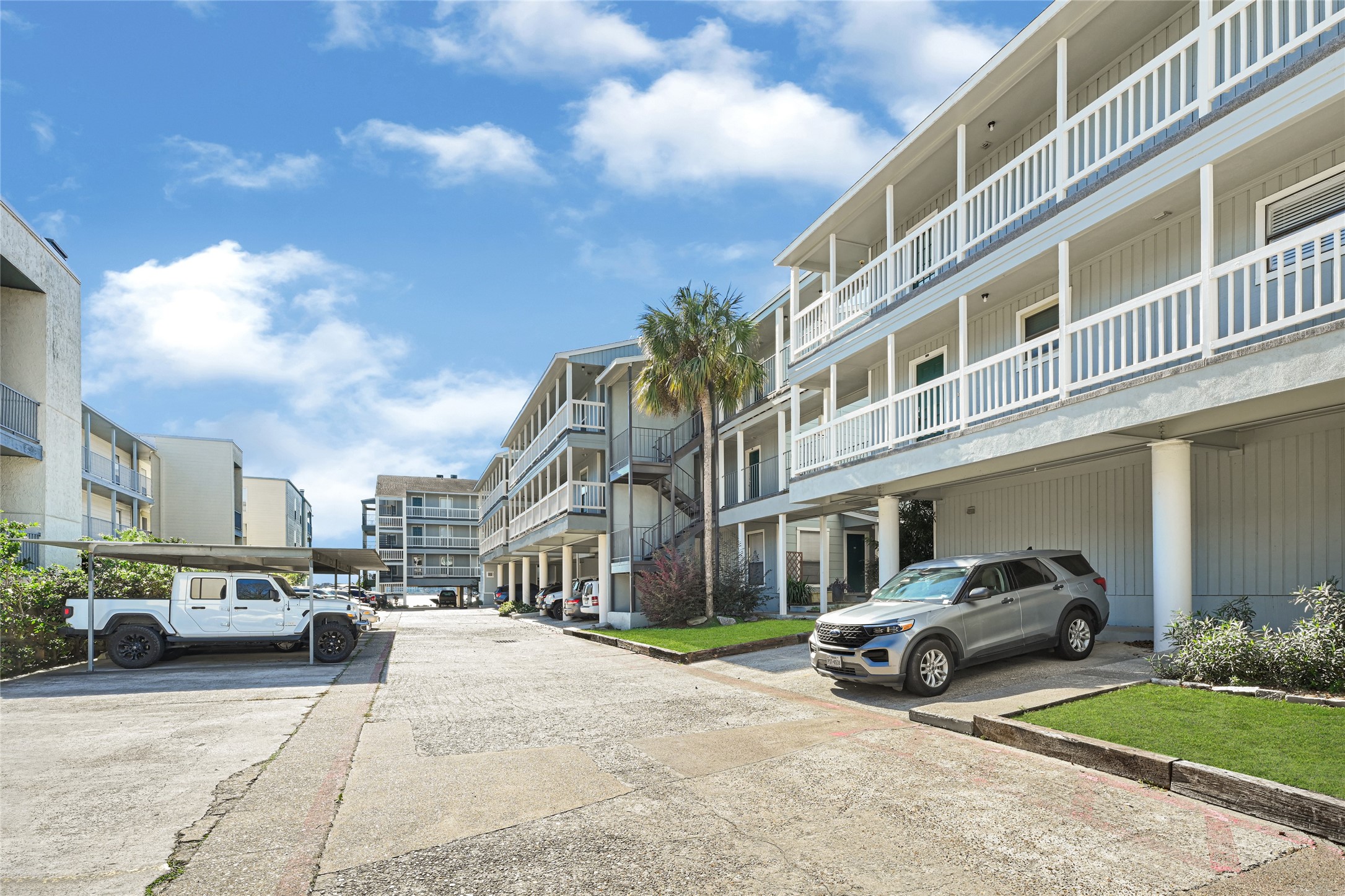4011 NASA Road 1, Unit 406 El Lago, TX 77586 - Photo 2 of 23 a view of a cars parked in front of a building