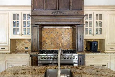 a kitchen with a stove and a microwave