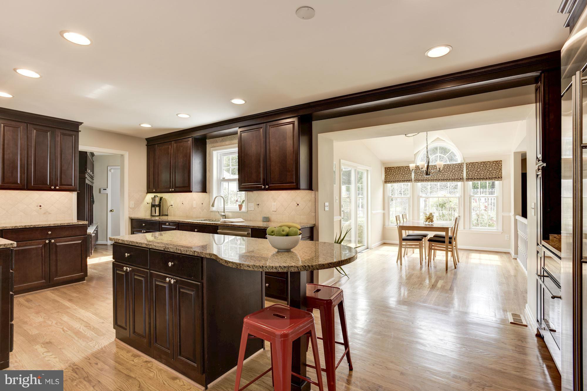 3001 Jackson Ridge Court Phoenix, MD 21131 - Photo 11 of 30 Granite Island w/Storage Open to Breakfast Area