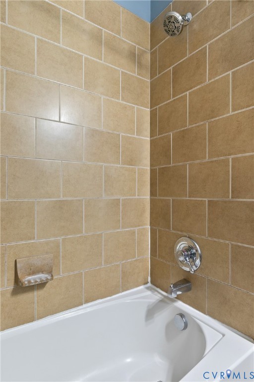 601 Roseneath Road, Unit U1 Richmond, VA 23221 - Photo 27 of 36 White bathtub with a chrome shower head and faucet