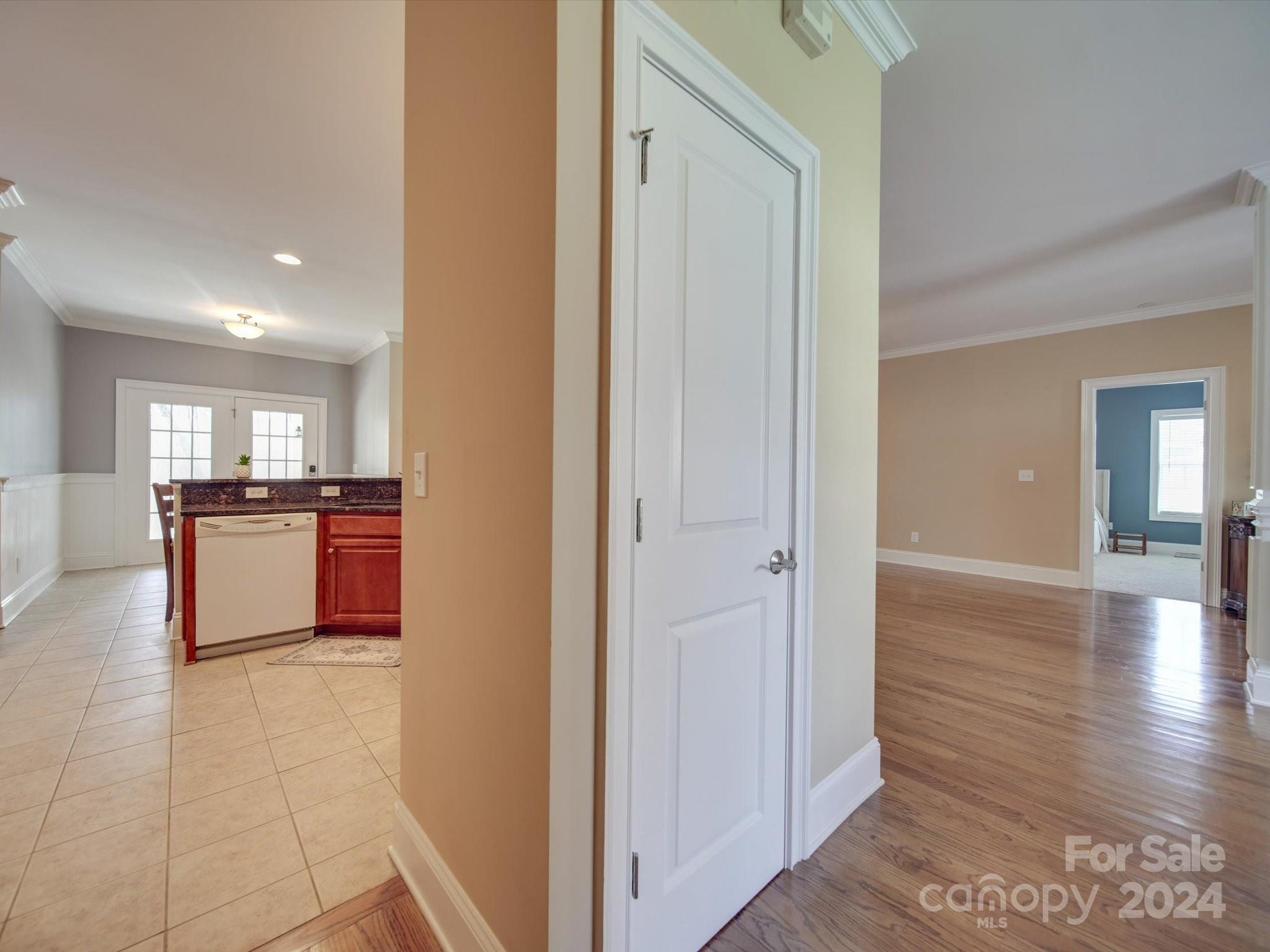 19617 Coachmans Trace Cornelius, NC 28031 - Photo 26 of 46 a view of kitchen and hall with wooden floor