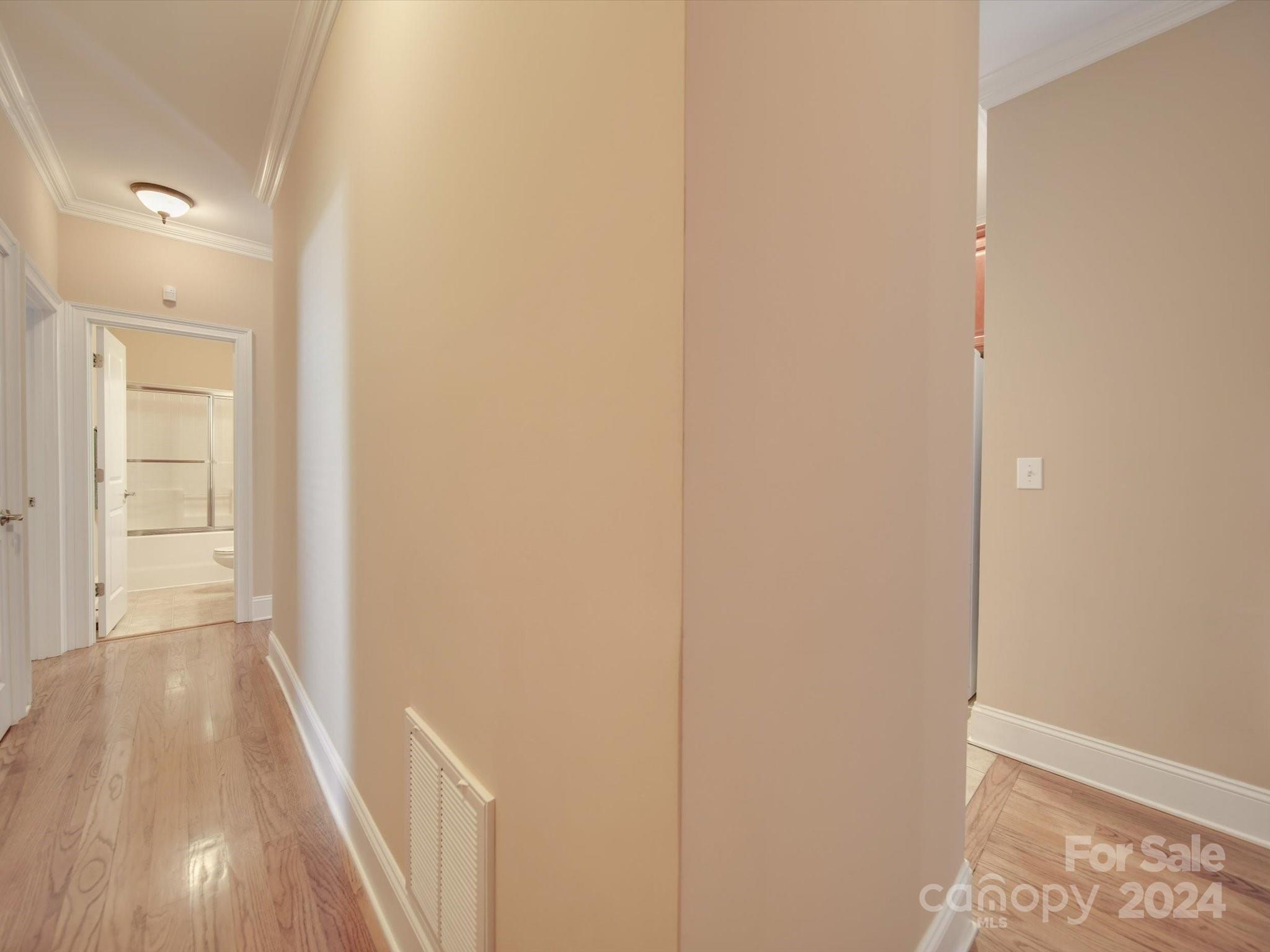 19617 Coachmans Trace Cornelius, NC 28031 - Photo 27 of 46 a view of a hallway with wooden floor