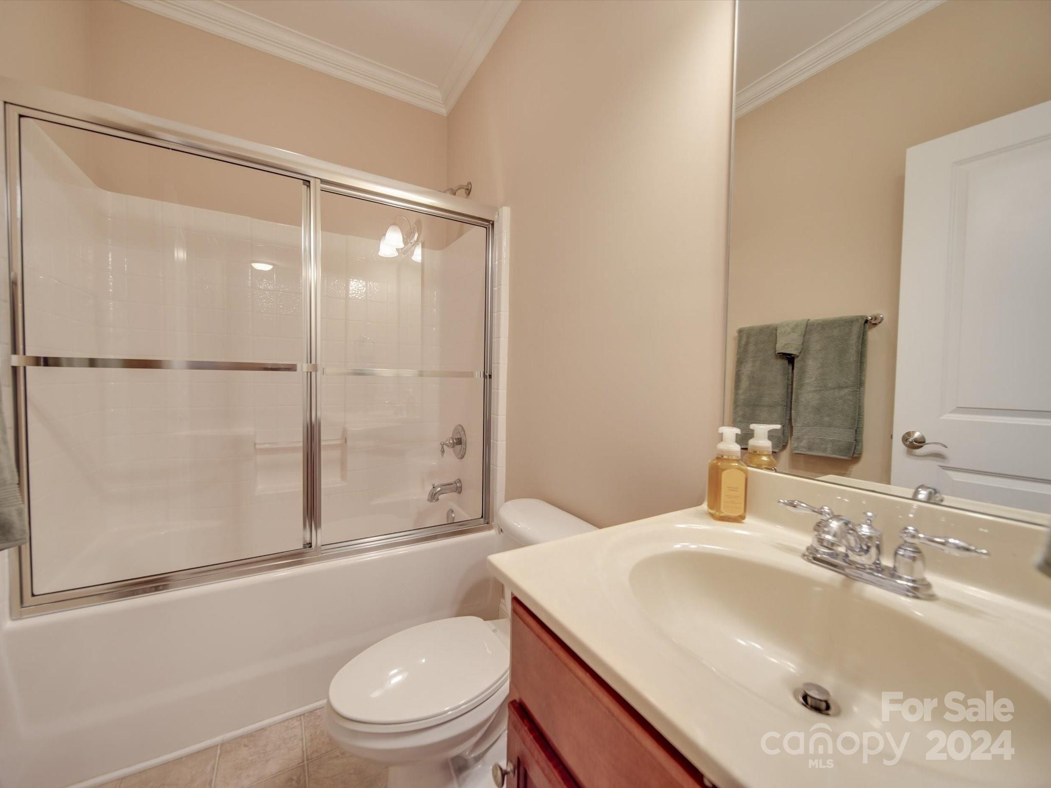 19617 Coachmans Trace Cornelius, NC 28031 - Photo 32 of 46 a bathroom with a sink toilet and shower