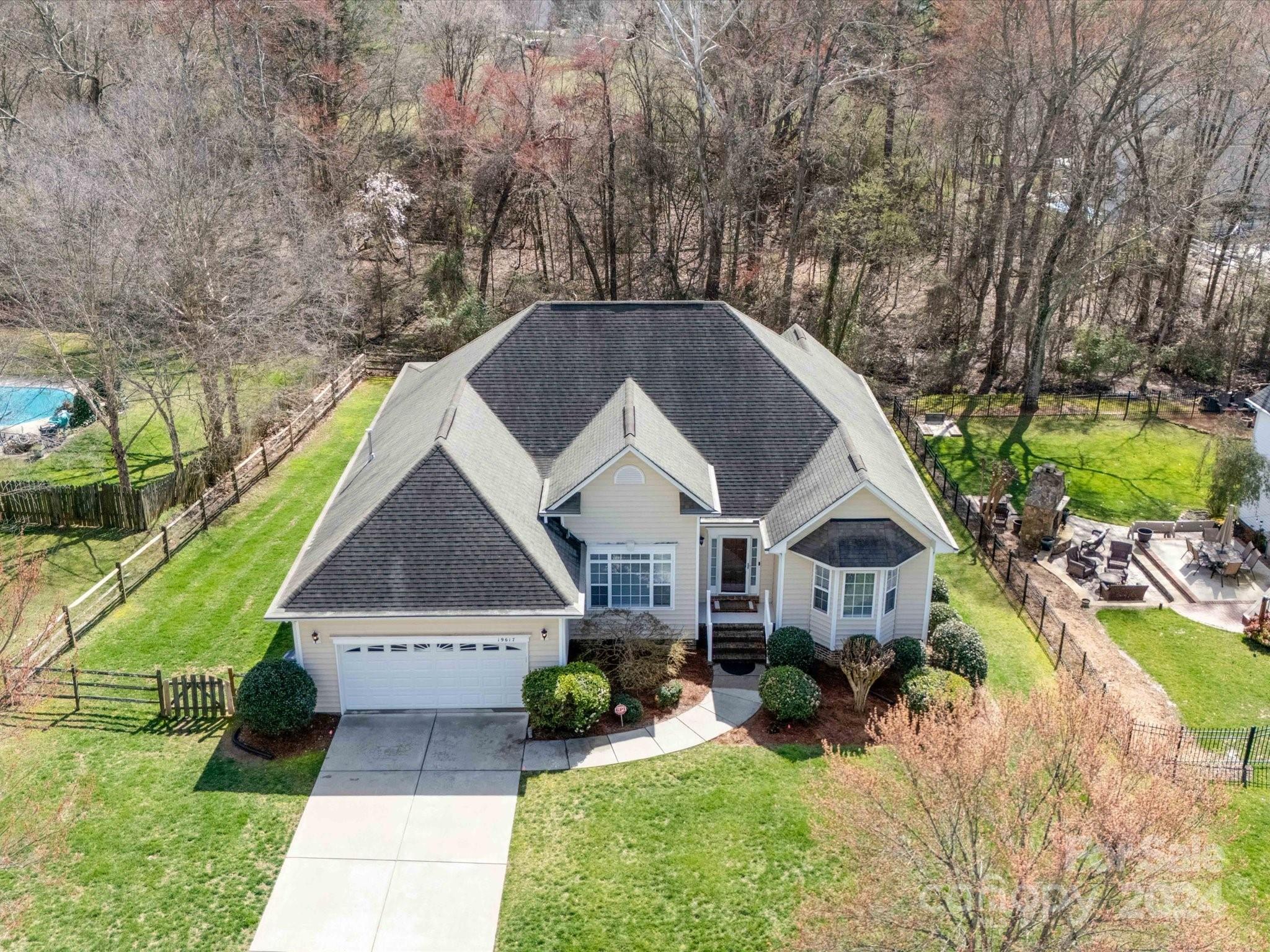 19617 Coachmans Trace Cornelius, NC 28031 - Photo 35 of 46 a front view of a house with garden