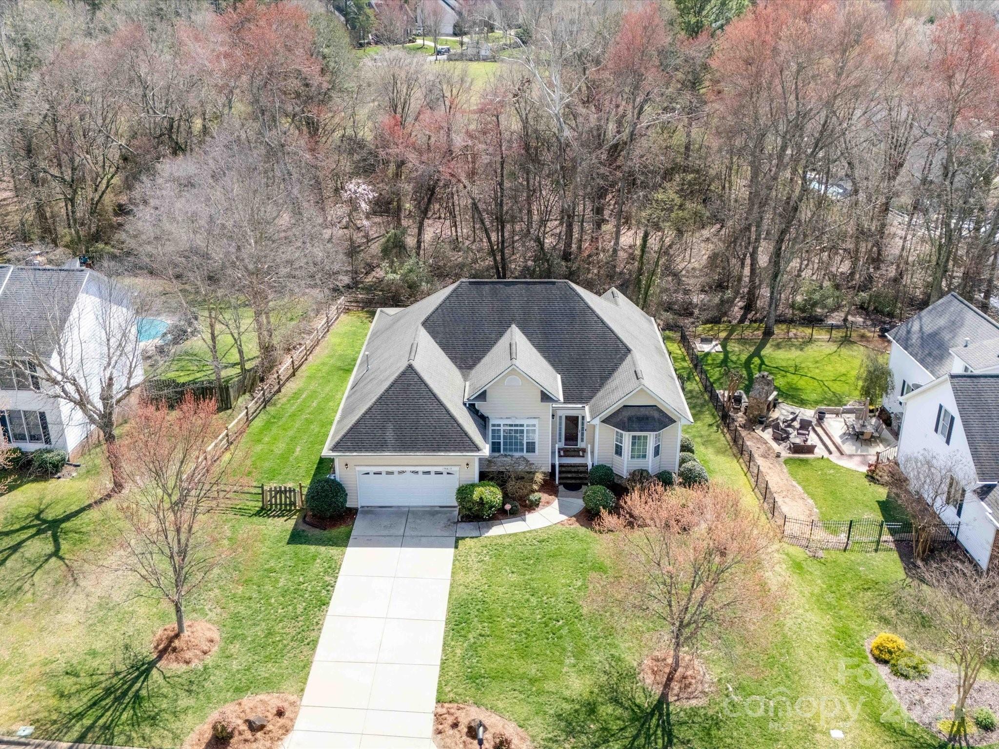 19617 Coachmans Trace Cornelius, NC 28031 - Photo 36 of 46 a front view of a house with a yard