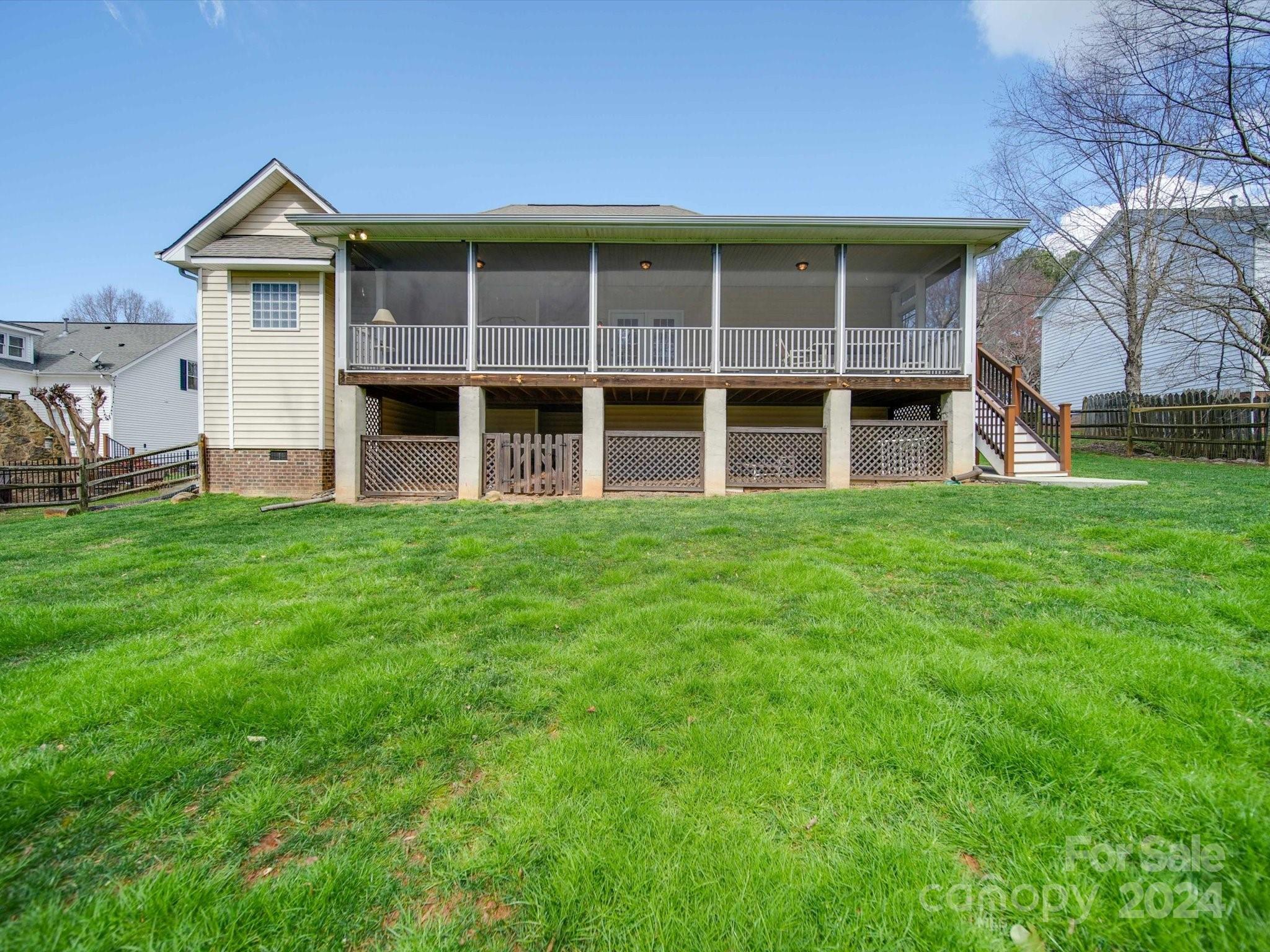 19617 Coachmans Trace Cornelius, NC 28031 - Photo 39 of 46 a big house with a big yard and large trees