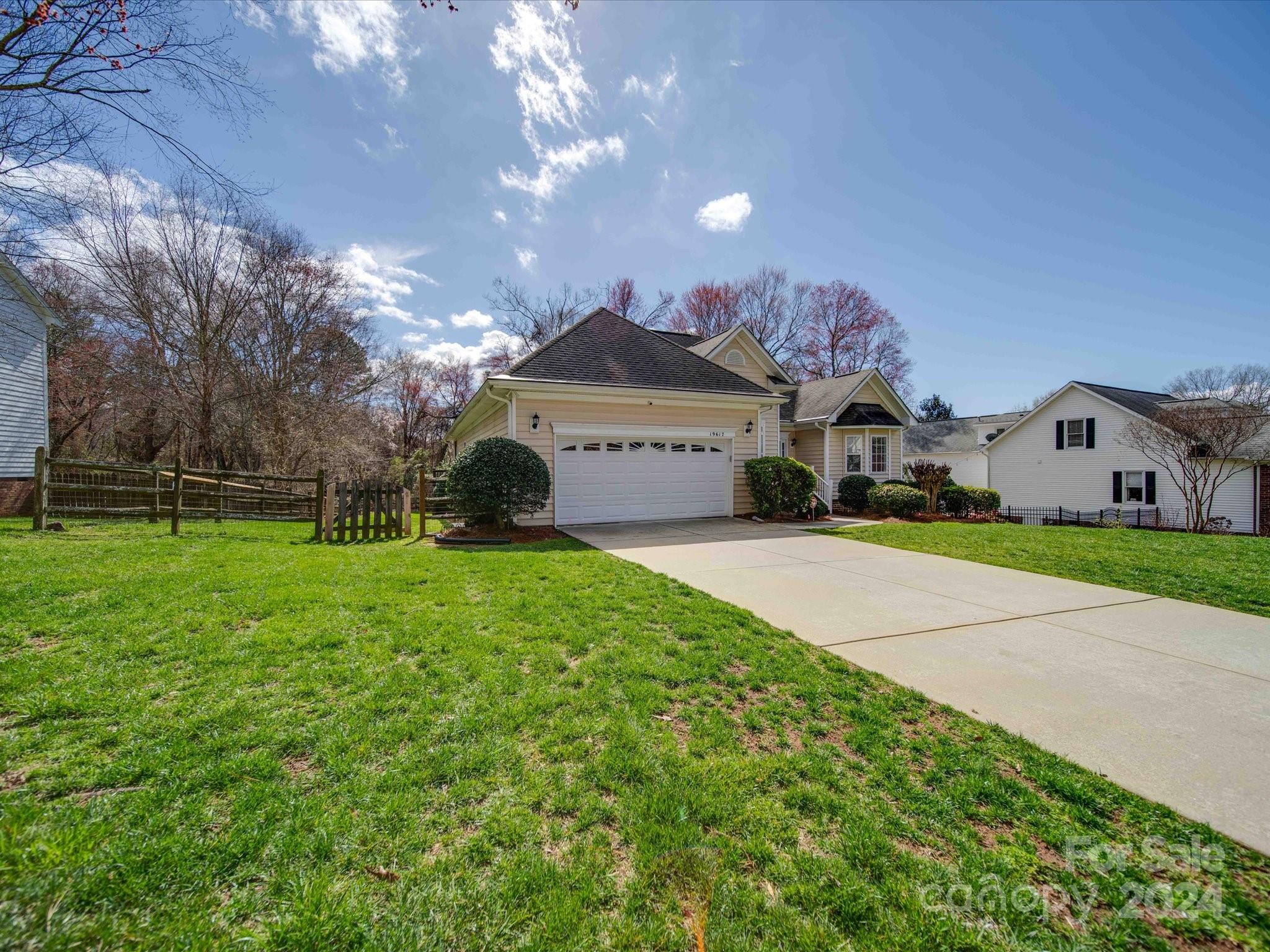 19617 Coachmans Trace Cornelius, NC 28031 - Photo 4 of 46 a front view of a house with garden