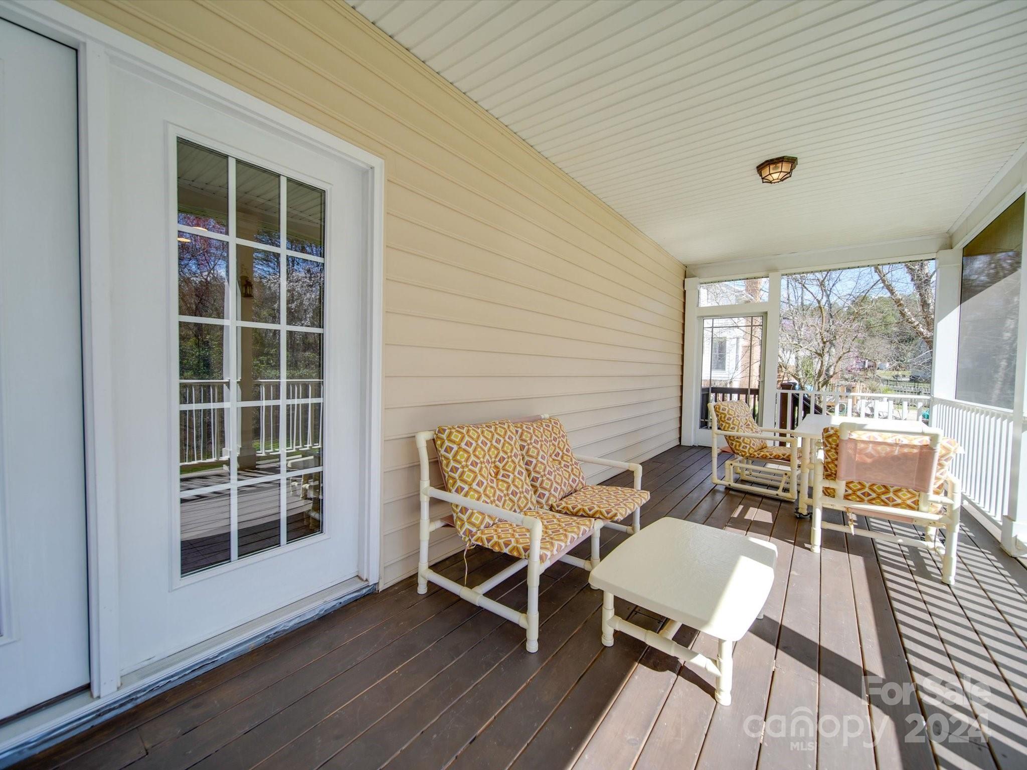 19617 Coachmans Trace Cornelius, NC 28031 - Photo 42 of 46 a balcony with table and chairs