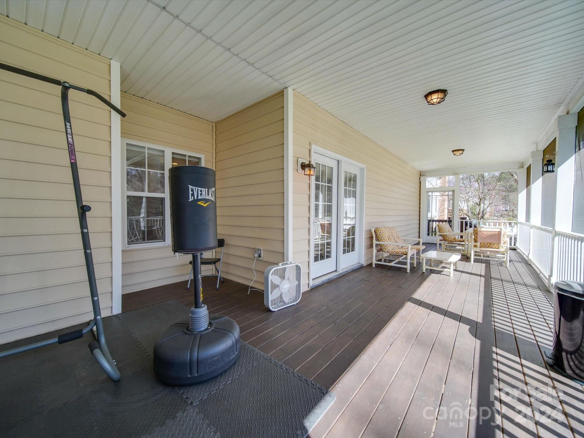 19617 Coachmans Trace Cornelius, NC 28031 - Photo 44 of 46 a living room with furniture and a wooden floor