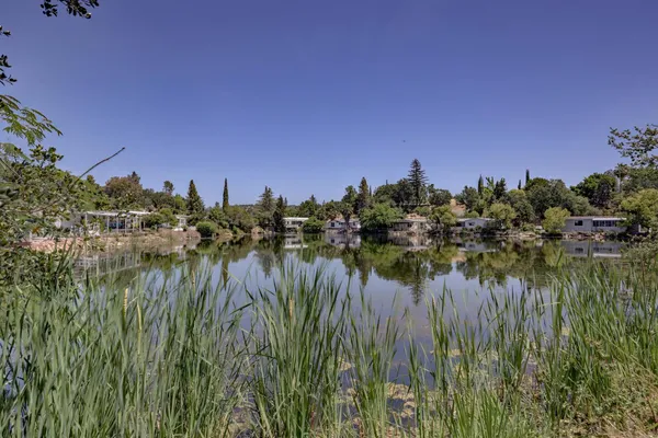 a view of a lake with a building in front of it