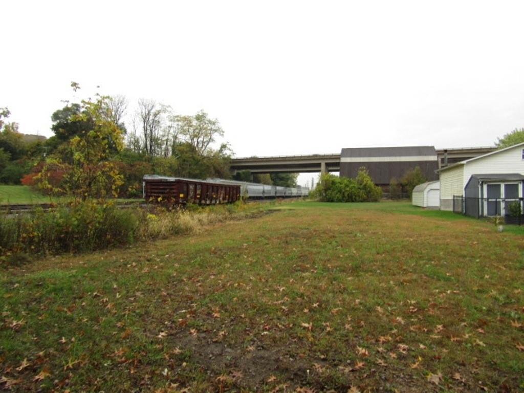 203 East Madison Avenue New Castle, PA 16102 - Photo 3 of 6 a view of a house with a yard