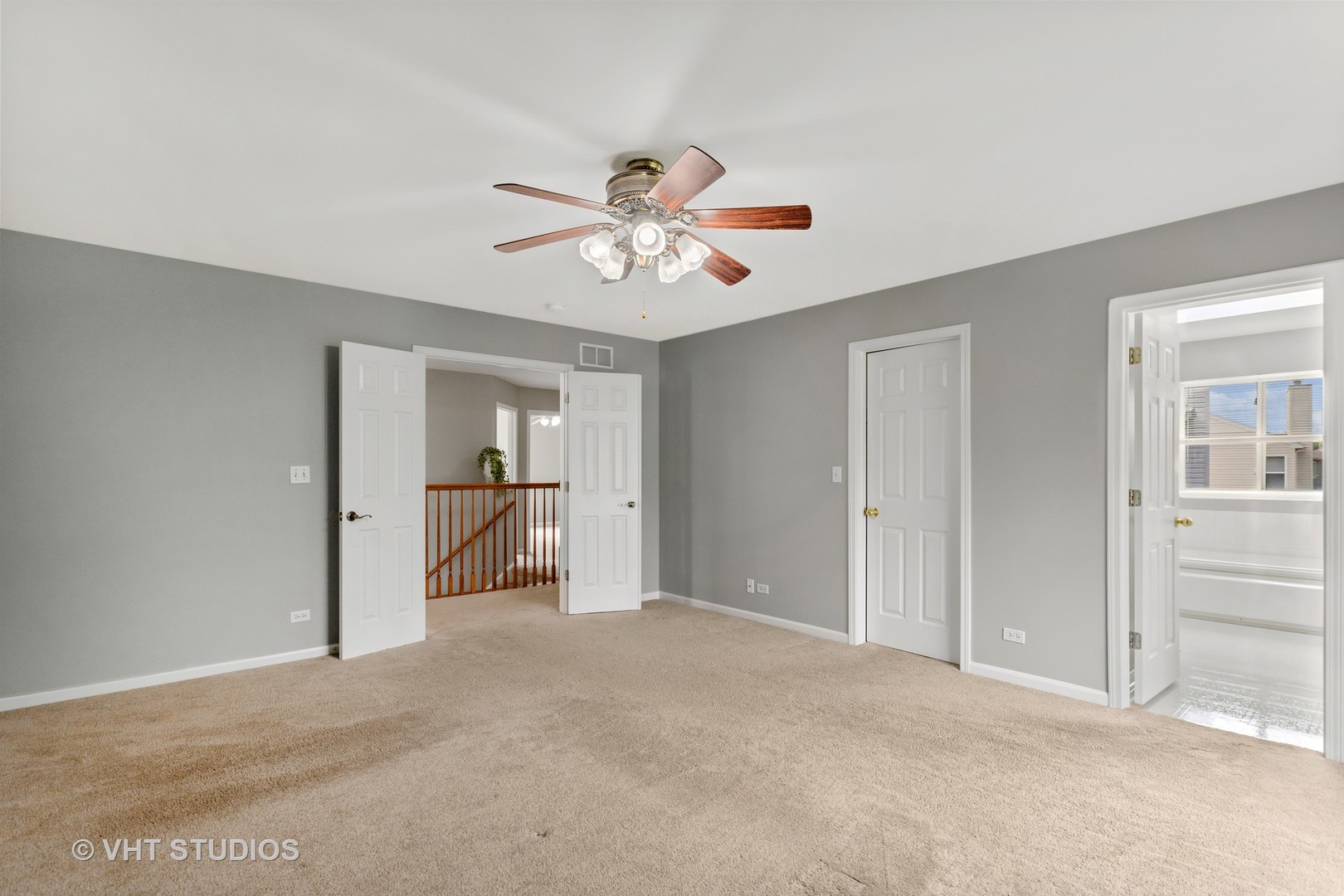 823 Fieldcrest Drive Naperville, IL 60540 - Photo 16 of 30 a view of a room with a ceiling fan and closet area