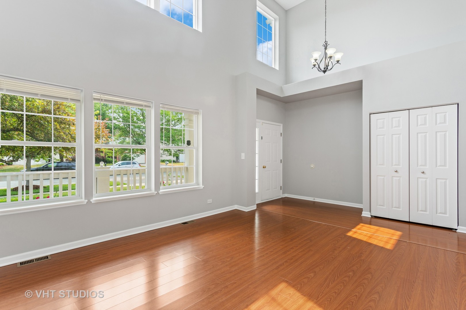 823 Fieldcrest Drive Naperville, IL 60540 - Photo 2 of 30 an empty room with wooden floor and windows