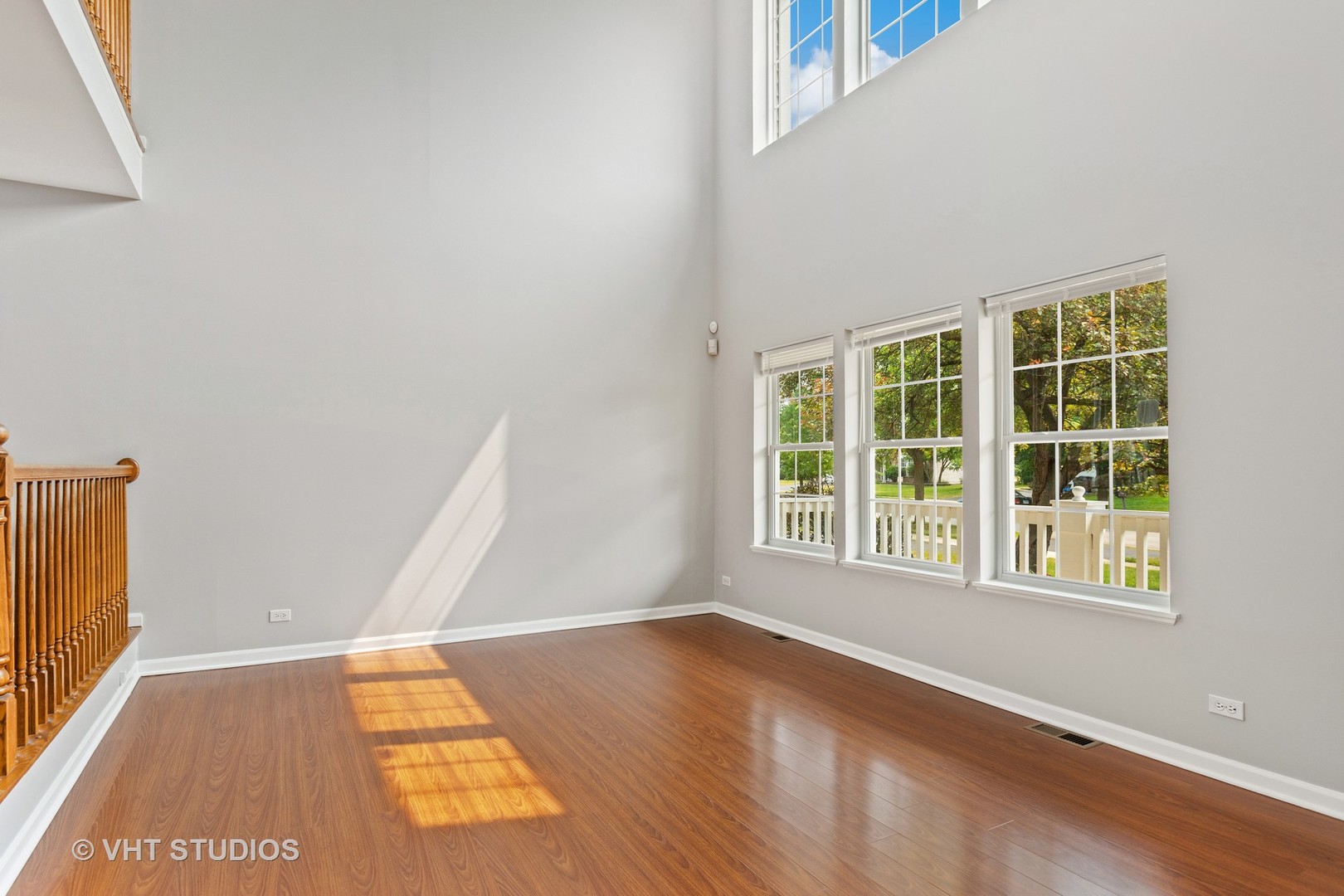 823 Fieldcrest Drive Naperville, IL 60540 - Photo 3 of 30 an empty room with wooden floor and windows