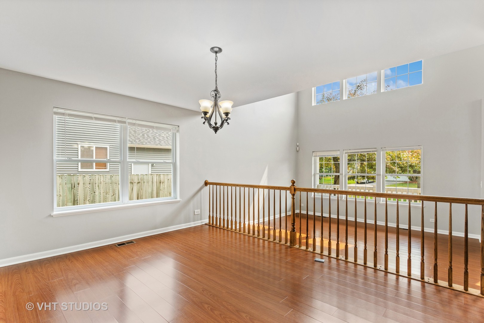 823 Fieldcrest Drive Naperville, IL 60540 - Photo 6 of 30 a view of an empty room with wooden floor and a window