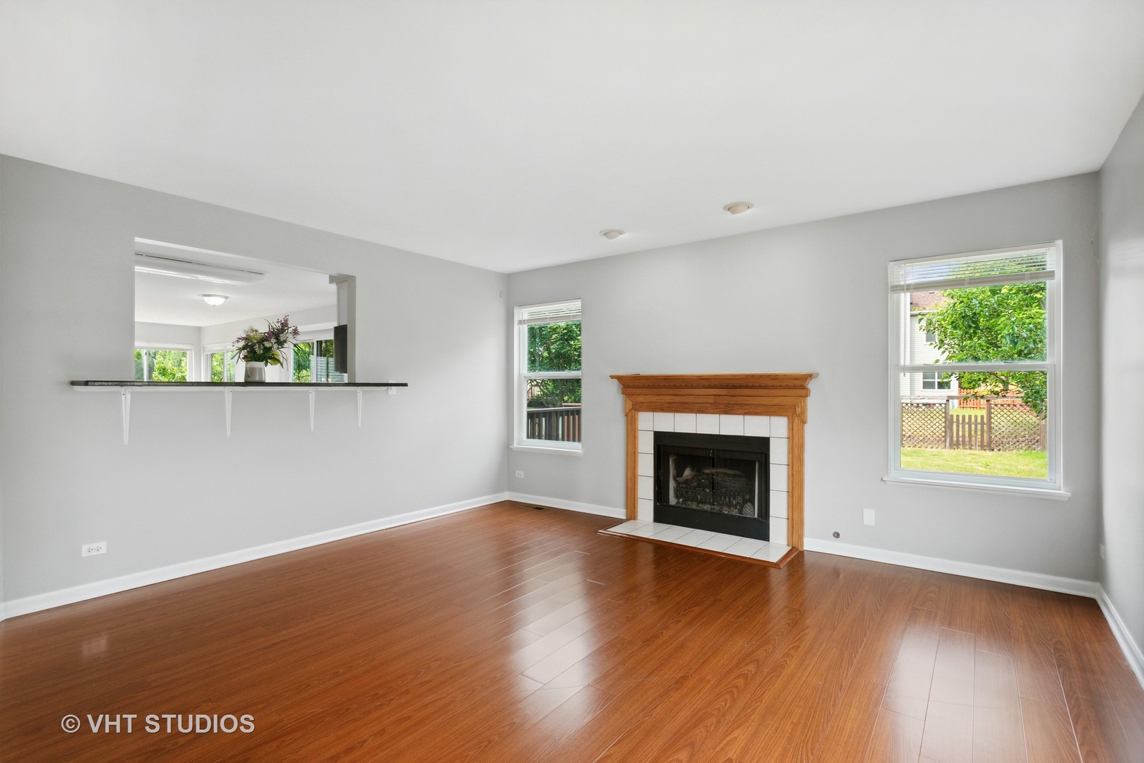 823 Fieldcrest Drive Naperville, IL 60540 - Photo 10 of 30 an empty room with windows and fireplace