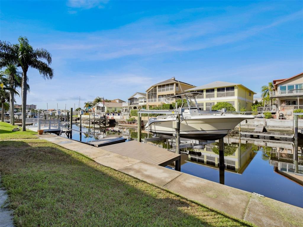 6241 Bayside Drive New Port Richey, FL 34652 - Photo 56 of 78 a view of a swimming pool with outdoor seating and yard