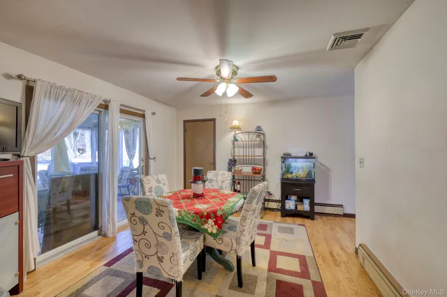 a dining room with furniture and window