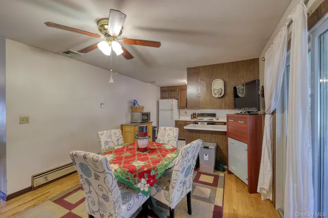 a view of a dining room with furniture and chandelier