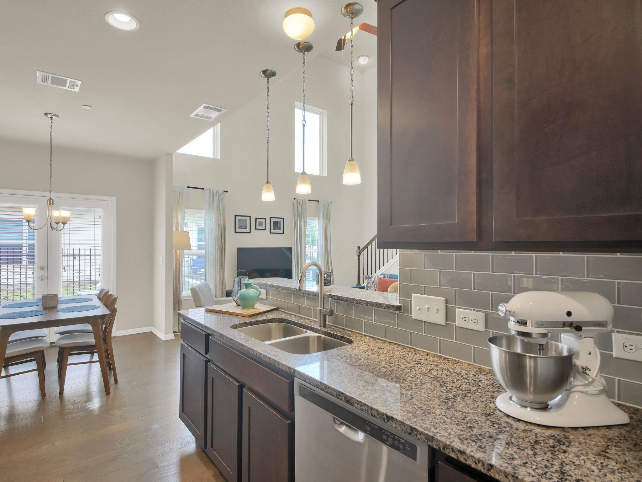 1600 Airedale Road, Unit 2601 Austin, TX 78748 - Photo 9 of 26 Granite counters and stainless appliances define this open-concept kitchen, perfect for culinary adventures and effortless entertaining.