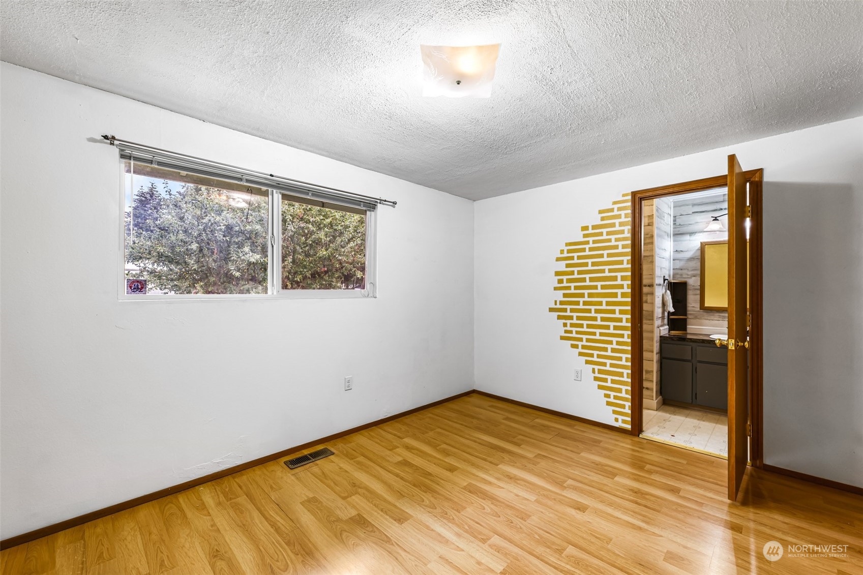 19131 Rosemary Street Southwest Rochester, WA 98579 - Photo 23 of 36 a view of empty room with wooden floor and fan