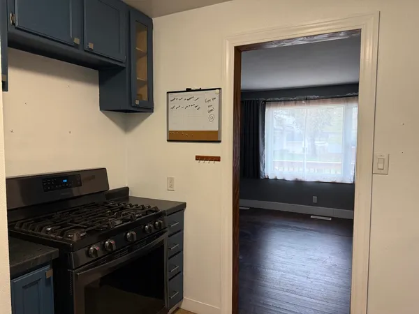 a kitchen with a stove and a refrigerator