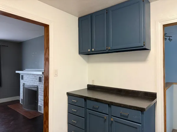 a view of storage and utility room with wooden floor