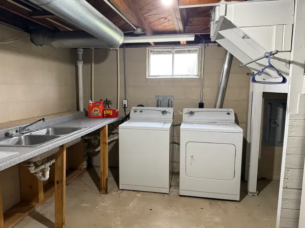 a utility room with dryer and washer