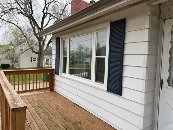 a view of a wooden house with a large window