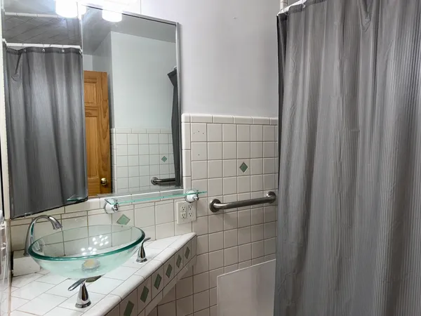 a bathroom with a sink and a mirror