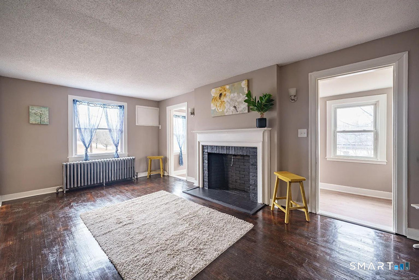 73 Silver Street Middletown, CT 06457 - Photo 7 of 30 a living room with furniture and a fireplace
